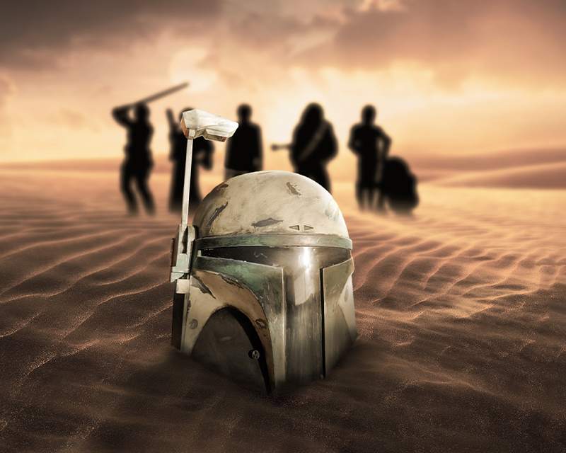 The helmet half-sunk in wind-carved sand at sunset, with a line of silhouetted figures on the horizon.